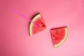 Conceptual shot with slices of ripe watermelon at pink background