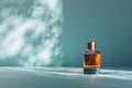 conceptual still life of glass parfume bottle on the minimalistic studio blue background with shadows, free space for Royalty Free Stock Photo