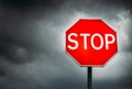 Conceptual stop sign with stormy background and copy space