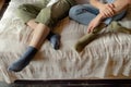 Conceptual storyline, Young Man and Woman in short socks on a bed