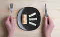 Conceptual studio shot of dinner table with euro bank notes on the plate instead of food. Concept for rising food prices Royalty Free Stock Photo