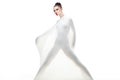 Conceptual studio young woman dressed in white.