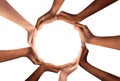 Conceptual symbol of multiracial human hands making a circle on white background with a copy space in the middle