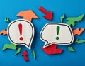 Conceptual symbols representing an argument and disagreement, featuring elements like speech bubbles, exclamation marks, and
