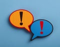 Conceptual symbols representing an argument and disagreement, featuring elements like speech bubbles, exclamation marks, and