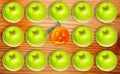 Conceptual view of allergic and hypoallergic fruits; green apples and smilling orange tangerine Royalty Free Stock Photo