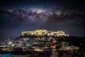 Conceptual view to the illuminated Acropolis of Athens under a starry sky with the milky way