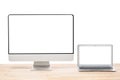 Conceptual workspace or business concept. Laptop computer and big computer monitor display with blank white screens on light Royalty Free Stock Photo