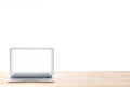 Conceptual workspace or business concept. Laptop computer with blank white screen on light wooden table. Isolated background.