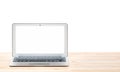 Conceptual workspace or business concept. Laptop computer with blank white screen on light wooden table. Isolated background. Royalty Free Stock Photo
