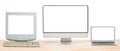 Conceptual workspace or business concept. Laptop computer, retro CRT monitor and big computer monitor display with blank white Royalty Free Stock Photo