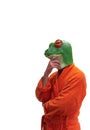 Conceptual young boy in green frog animal mask with orange bathrobe with hand on head collar pensive on white background Royalty Free Stock Photo