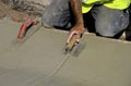 Concerete worker trowels wet cement Royalty Free Stock Photo