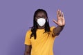 Concerned african american man with protective mask showing stop gesture Royalty Free Stock Photo