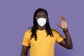 Concerned african american man with protective mask showing volunteer gesture Royalty Free Stock Photo