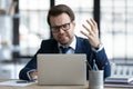 Concerned annoyed office employee upset about problems with laptop