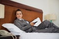 Concerned business woman laying on bed Royalty Free Stock Photo