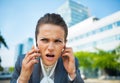Concerned business woman talking cell phone Royalty Free Stock Photo