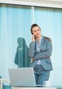 Concerned business woman talking mobile phone Royalty Free Stock Photo