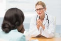 Concerned doctor listening to her patient