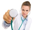 Concerned doctor woman listening with stethoscope