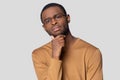 Concerned doubting african guy looking at camera studio shot Royalty Free Stock Photo