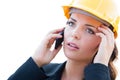 Concerned Female Contractor In Hard Hat Using Cell Phone Isolated On White Royalty Free Stock Photo