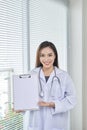 Concerned medical doctor with stethoscope showing on empty blank Royalty Free Stock Photo