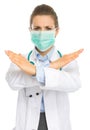 Medical doctor woman in mask showing stop gesture Royalty Free Stock Photo