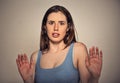 Concerned scared woman dodging something arms raised Royalty Free Stock Photo