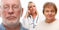 Concerned Senior Couple and Female Doctor Behind Royalty Free Stock Photo