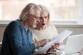 Concerned aged couple shocked by information online Royalty Free Stock Photo