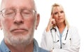 Concerned Senior Man and Female Doctor Behind Royalty Free Stock Photo