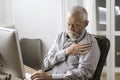 Concerned senior man having an heart attack Royalty Free Stock Photo