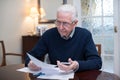 Concerned Senior Man Reviewing Domestic Finances