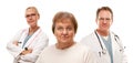 Concerned Senior Woman with Doctors Behind Royalty Free Stock Photo