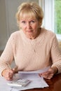 Concerned Senior Woman Reviewing Domestic Finances