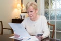 Concerned Senior Woman Reviewing Domestic Finances Royalty Free Stock Photo