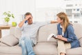 Concerned therapist talking with male patient Royalty Free Stock Photo