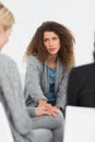 Concerned woman comforting another in rehab group at therapy Royalty Free Stock Photo