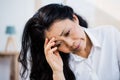 Concerned woman sitting at home