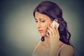 Concerned woman talking on mobile phone Royalty Free Stock Photo