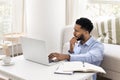 Concerned young African freelancer man thinking on business project Royalty Free Stock Photo