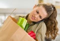 Concerned young housewife with big shopping bag Royalty Free Stock Photo