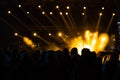 Concert background. Yellow spotlights on the stage and silhouette of people Royalty Free Stock Photo