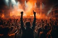 Concert crowd with hands raised in front of a live concert stage, cheering crowd at a rock concert, AI Generated Royalty Free Stock Photo