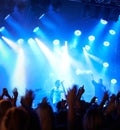 Concert crowd, music festival singer and band audience listen to rock, metal or hip hop artist, rap star or live stage