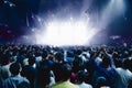 Concert crowd of people in front of bright stage lights Royalty Free Stock Photo