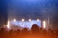 Concert crowd. People silhouettes in front of bright stage lights. Band of rock stars. Royalty Free Stock Photo