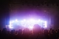 Concert crowd. People silhouettes in front of bright stage lights. Band of rock stars. Royalty Free Stock Photo